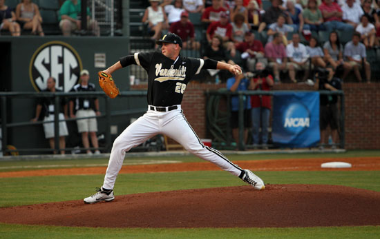 Vanderbilt's Tony Kemp runs from third base to score against North Carolina  on a sacrifice fly by Anthony Gomez in the first inning of an NCAA College  World Series elimination baseball game